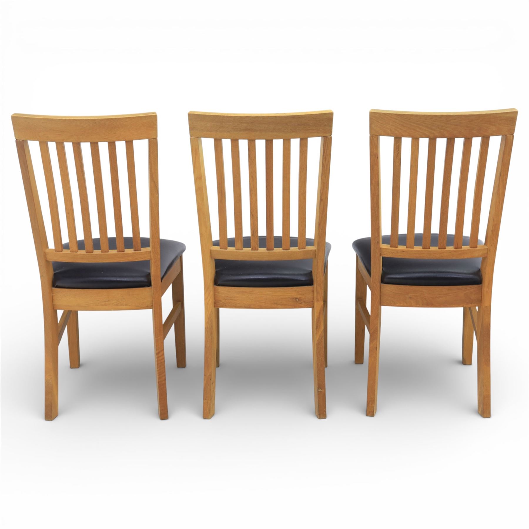 Solid light oak extending dining table with single leaf, and set of six chairs