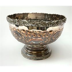 An early 20th century Barker Ellis Silver Co Ltd silver plated punch bowl, with embossed foliate detail to the body, applied rim with fruiting vines and acanthus leaves, and raised upon a stepped circular base with gadrooned detail, with MS shield mark beneath for Barker Ellis, H22c, D31cm. 