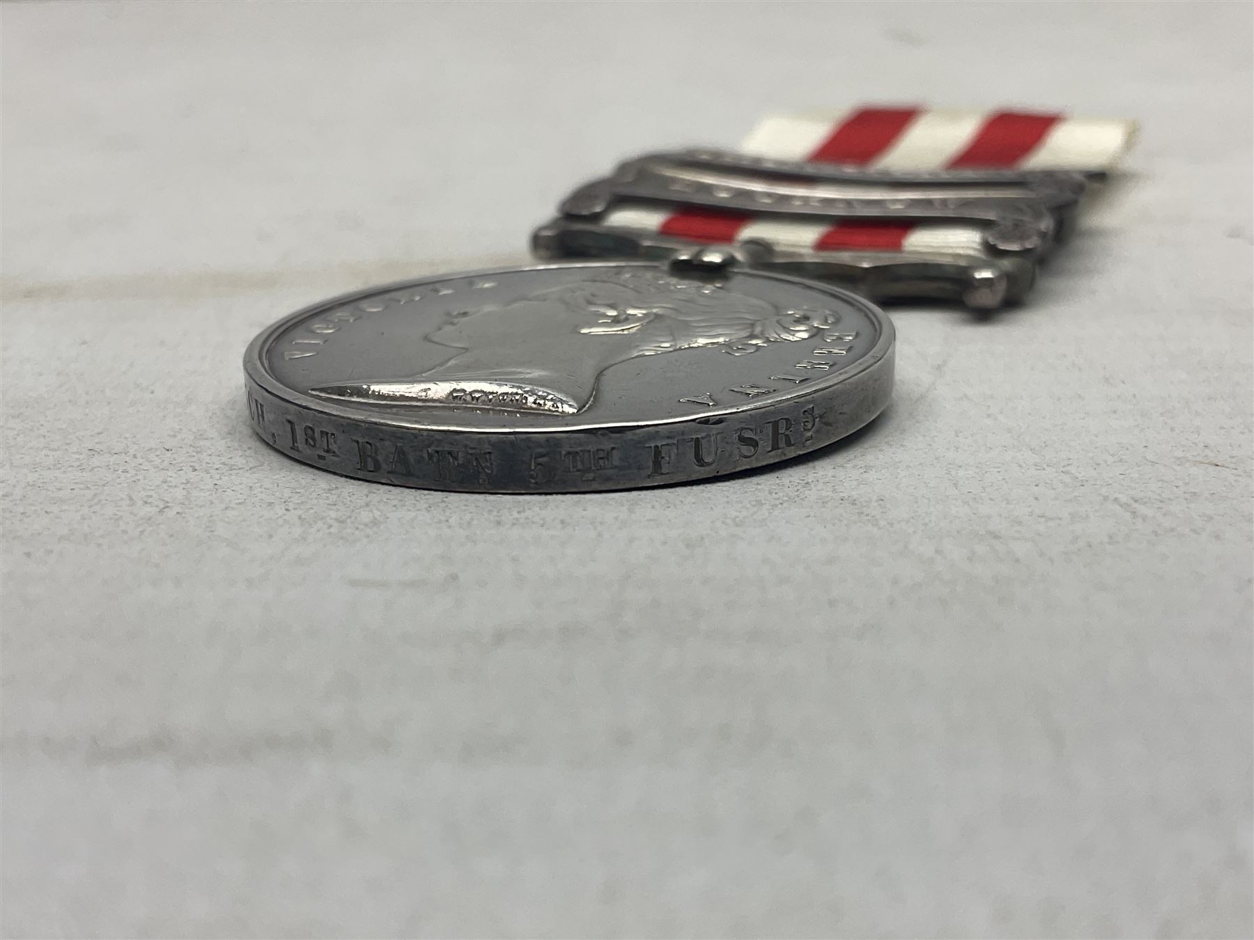 Victoria Indian Mutiny Medal with two clasps for Lucknow and Defence of Lucknow awarded to J. French 1st Batn. 5th Fusrs., with ribbon; some biographical details