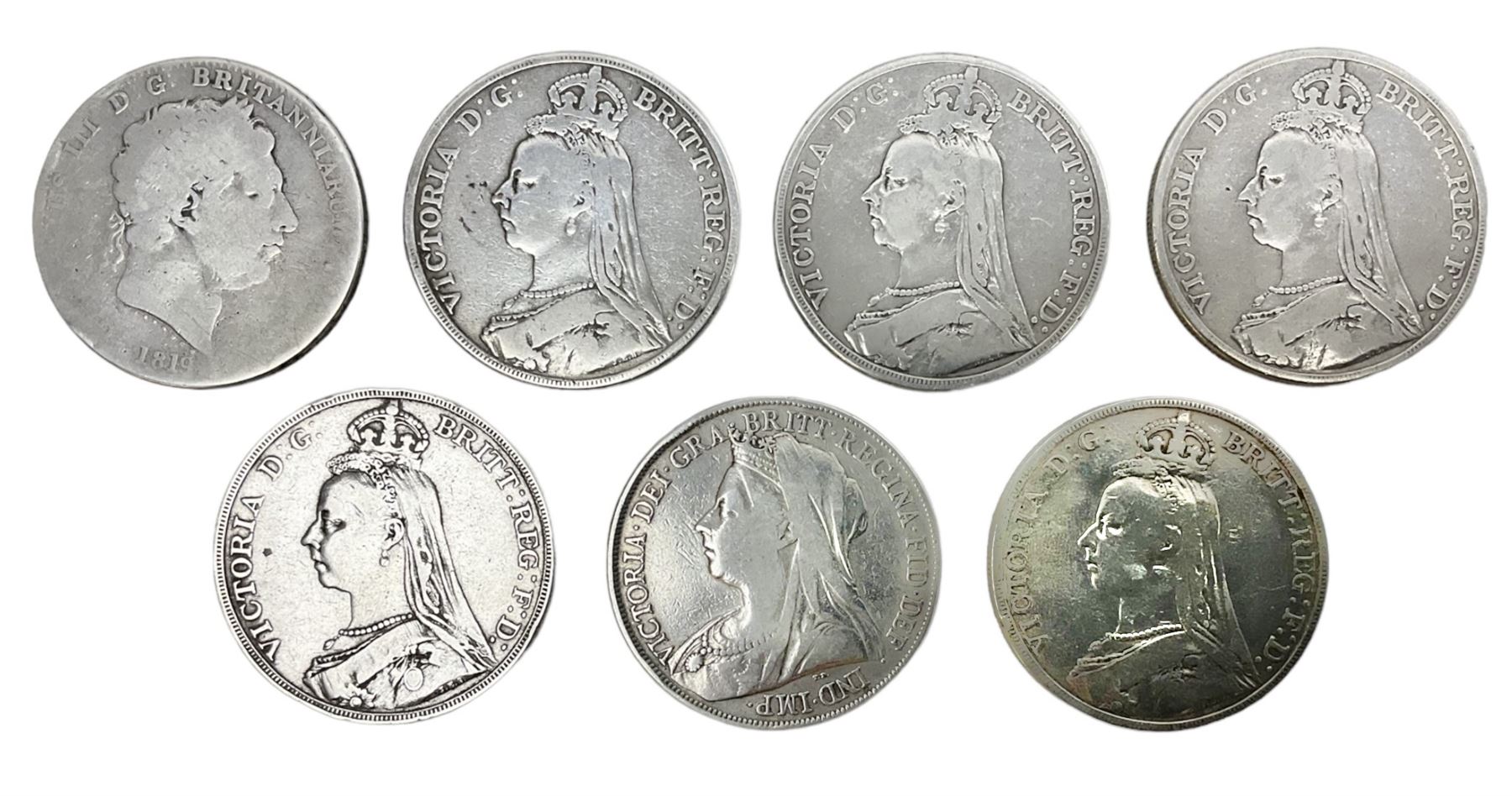 George III 1819 crown coin and six Queen Victoria crown coins dated 1889, three 1890, 1891 and 1900 (7)