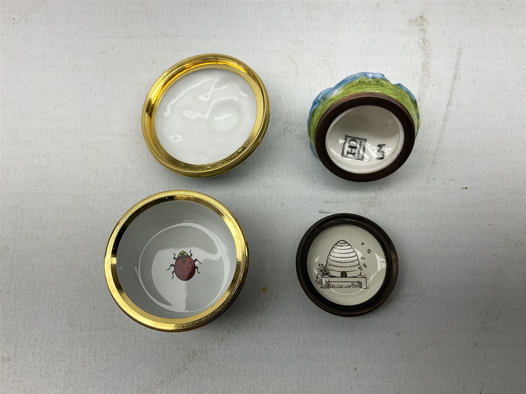 Two Halcyon Days enamel bonbonnieres modelled as mice, I am a magical mouse, and ''Consider the little mouse, how sagacious an animal it is...' Roman Playwright', together with three Halcyon Days enamel boxes, modelled as a bee upon a flower, a ladybird upon a leaf, and a strawberry, each in fitted box, (5)