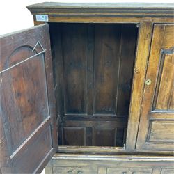Georgian design scumbled pine wardrobe disguised as a housekeepers cupboard, two panelled doors enclosing hanging rail, five faux drawers over the single drawer fitted to base, on square feet