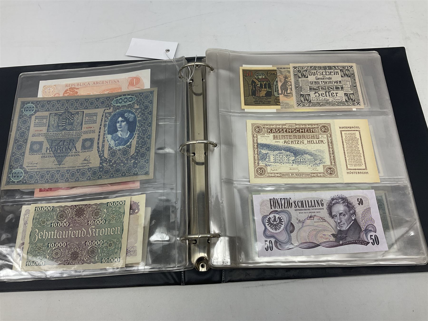 World banknotes, including Queen Elizabeth II The States of Jersey one pound 'DB202703', five pounds 'BB527762' and ten pounds 'AB651481', reserve bank of New Zealand two dollars '1L3 741894', King George V Straits Settlements one dollar 1st January 1935 'F/83 28924', various Bank of England notes etc, housed in two ring binder albums