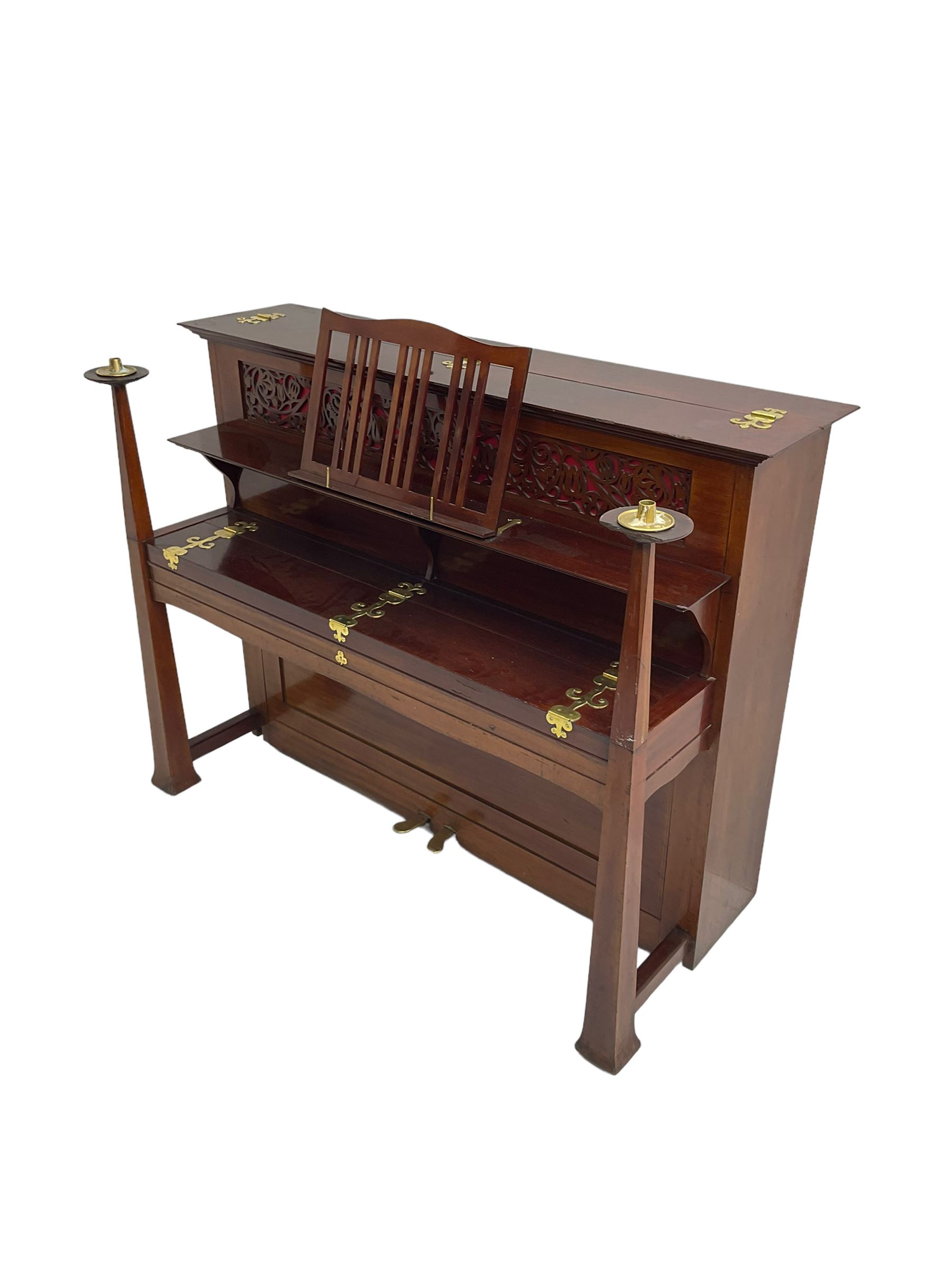 Carl Bechstein - late 19th century German overstrung upright piano, in a model 4 Arts and Crafts case designed by Walter Cave, with a lattice music desk and fretted silk backed front panel, brass hinged case lid and key fall with square tapered candle holders and circular sconces, iron frame, serial number 52187 (1899-1900), with an under damper action, 85 ebony and ivory keys, sustain and una corda pedals, original action, stringing, dampers, and action return straps, registered case number 328639, USA patent 24805.

This item has been registered for sale under Section 10 of the APHA Ivory Act