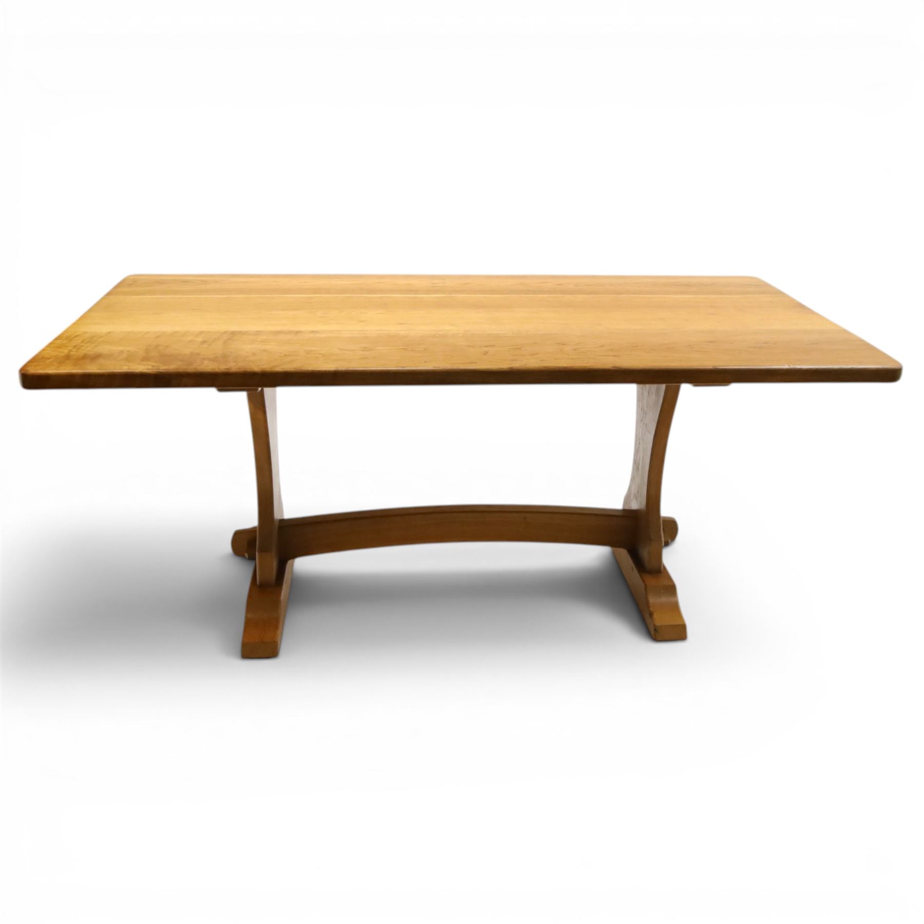 Knightman - oak refectory dining table, the rectangular adzed top raised on shaped trestle supports joined by central stretcher, with recessed carved knight trademark, by Horace Knight of Old Mill Furniture, Balk near Thirsk