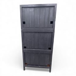 20th century Thai elm compound cabinet, formed of three stacking chests each enclosed by double panelled doors with decorative wrought metal lock plates and hinges, raised on pierced apron on stile feet