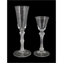 18th century ale glass, the funnel bowl raised upon a single series air twist double knopped stem and conical foot, H20cm, together with a similar smaller drinking glass, H15.5cm