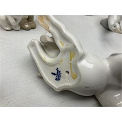 Seven Lladro figures, comprising Playful Puppy no 9135, Platero and Marcelino/Boy Hugging Donkey no 1181, Mini Seal Family no 5318, Attentive Polar Bear no 1207, Seated Polar Bear no1209, Eskimo Boy with Pet no 5238 and Girl with Geese no 1035, together with Nao goose