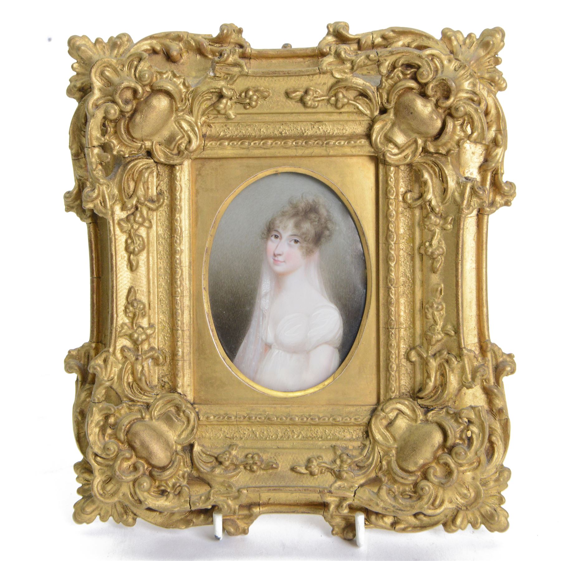 English School (early 19th century) 
Portrait miniature upon ivory 
Head and shoulder portrait of Caroline Chichester wife of the Revd John Munden, wearing white empire line gown and gauze shawl
Within period giltwood frame
Oval 9cm x 6.5cm 
Overall 20.5cm x 18cm 

Provenance: By family descent from the Chichesters of Arlington Court, Devon; from the collection of Andrew Chichester Everitt.

This lot has been registered for sale under Section 10 of the APHA Ivory Act