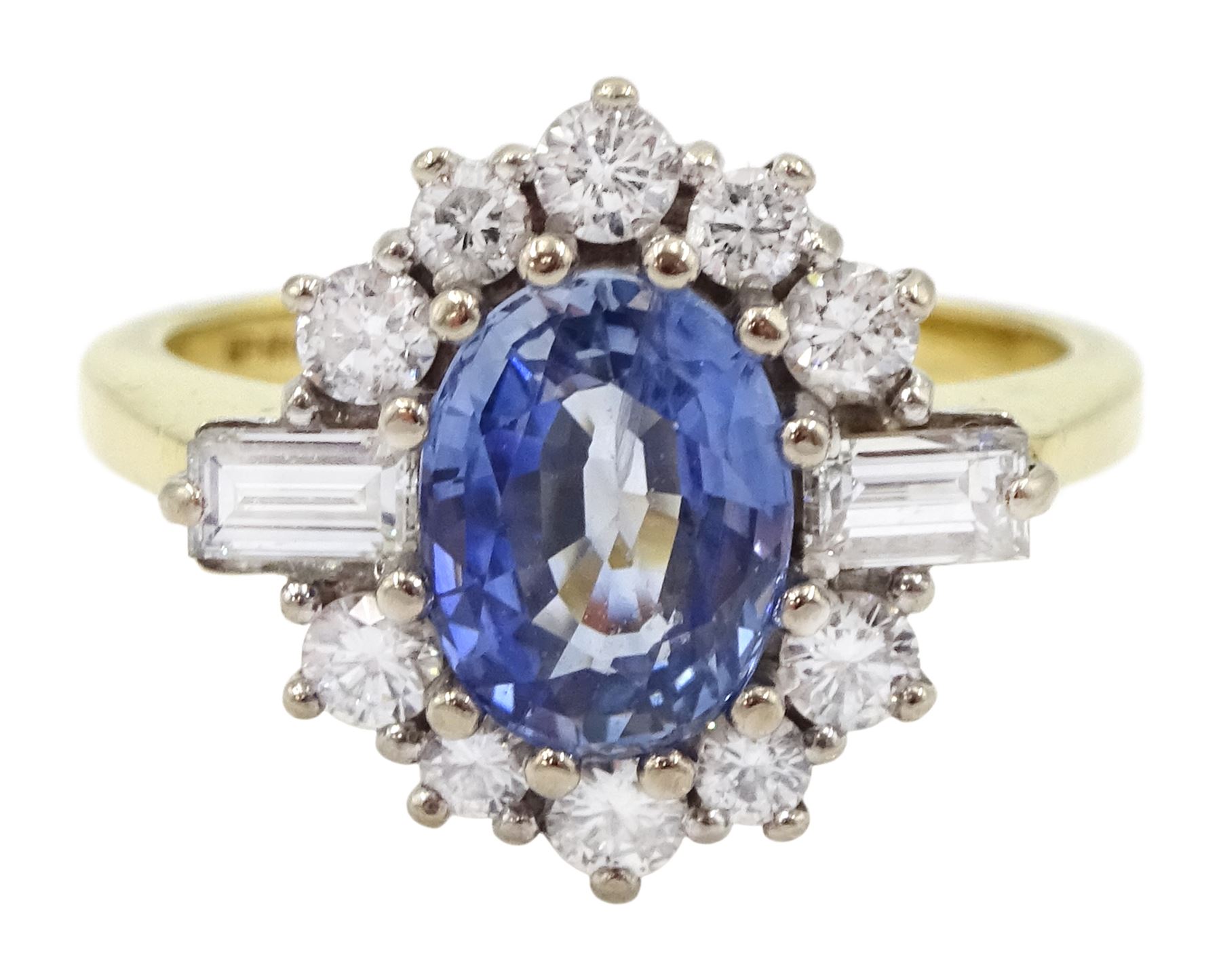 18ct gold oval sapphire, baguette and round brilliant cut diamond cluster ring, Birmingham 1991, sapphire approx 1.35, total diamond weight approx 0.50 carat