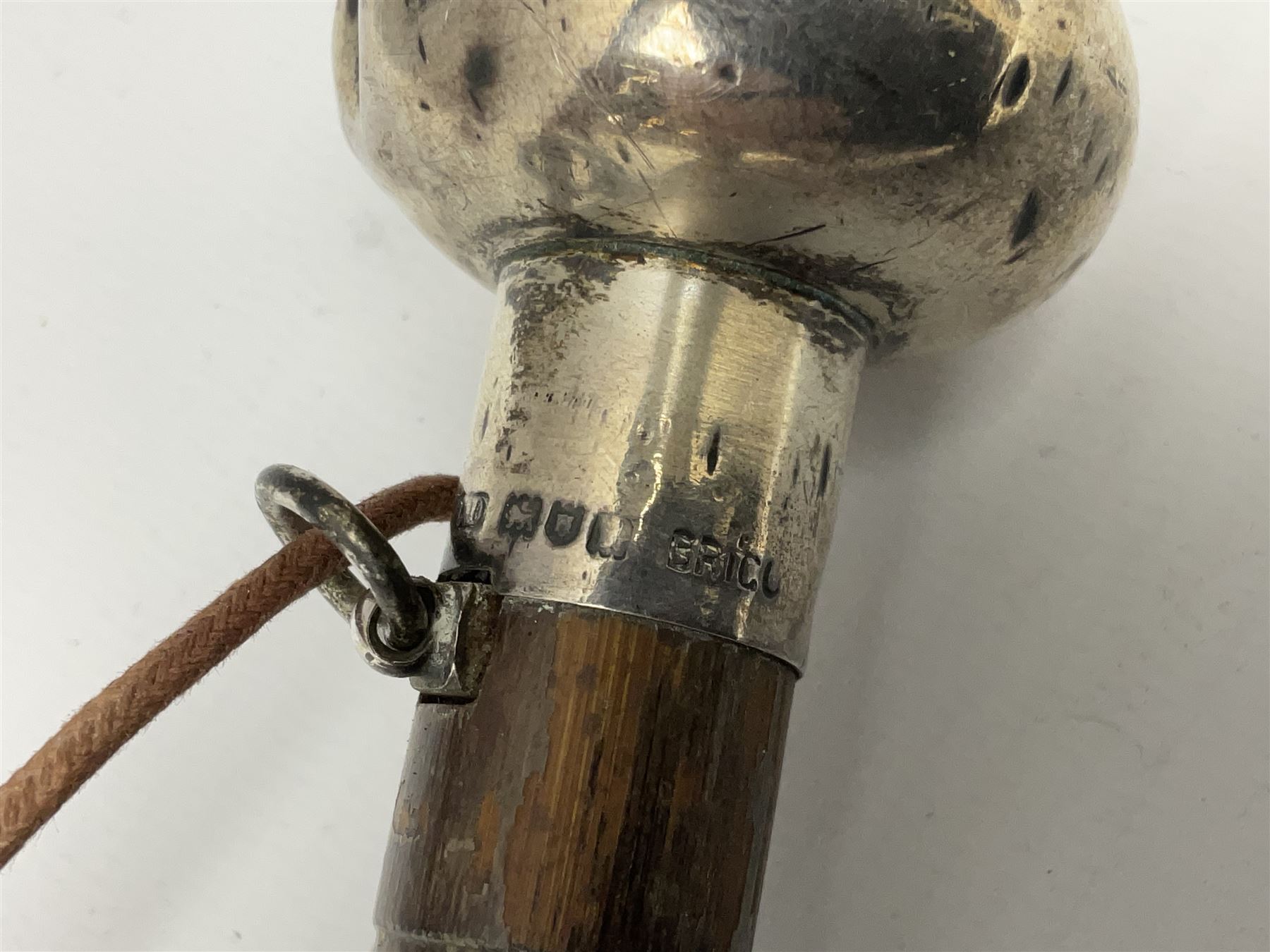 Edwardian novelty parasol by Briggs of London, the bamboo shaft with brown fabric canopy, and silver mounted terminal concealing a silver mounted pencil, hallmarked Charles Henry Dumenil, London 1904, also marked Briggs, H93cm