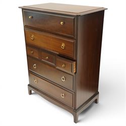Stag Minstrel - pair of mahogany combination chests, fitted with an assortment of seven drawers with brass ring and pull handles, on bracket feet