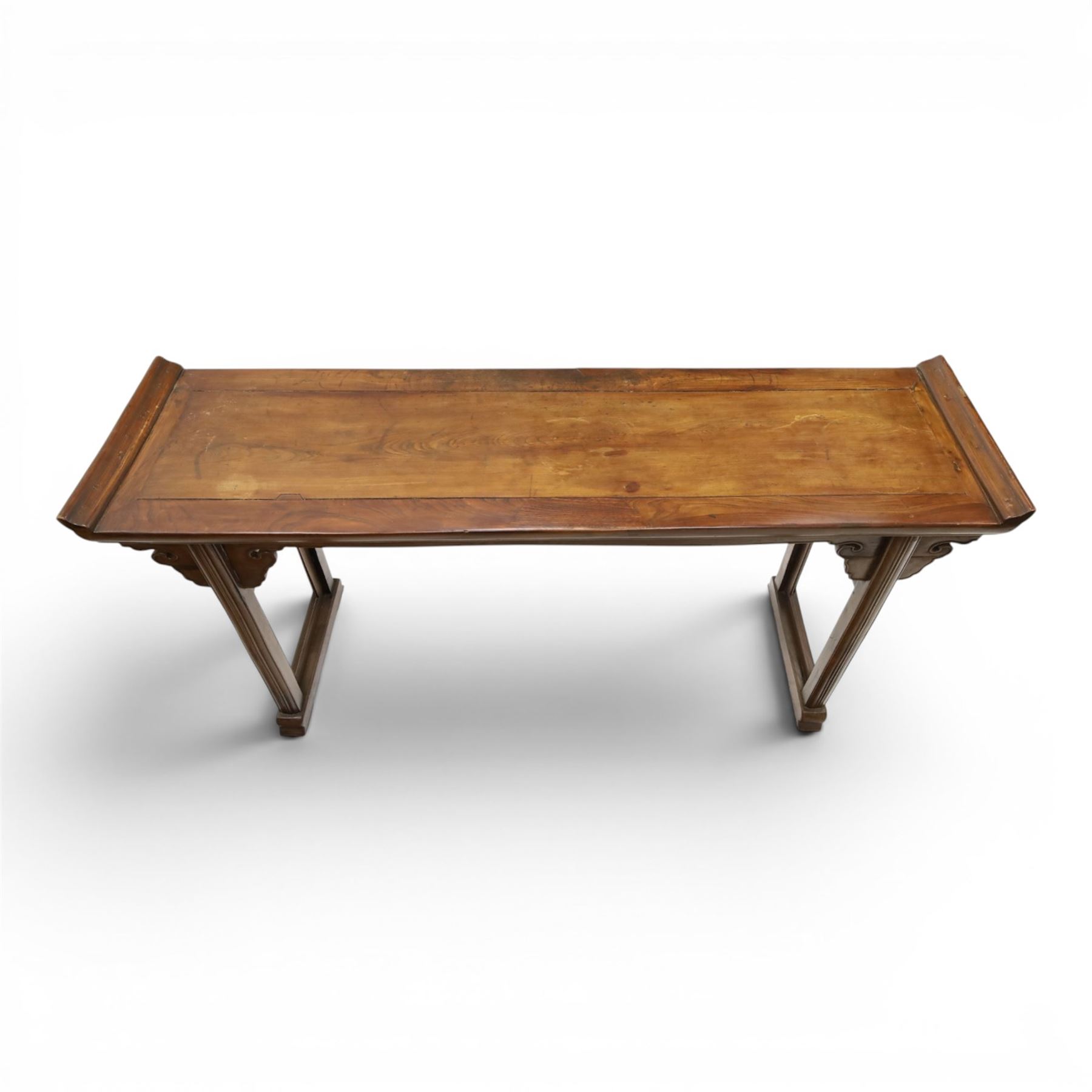 Chinese elm altar table, rectangular plank top with galleried sides, raised on reeded square supports with scrolled spandrels