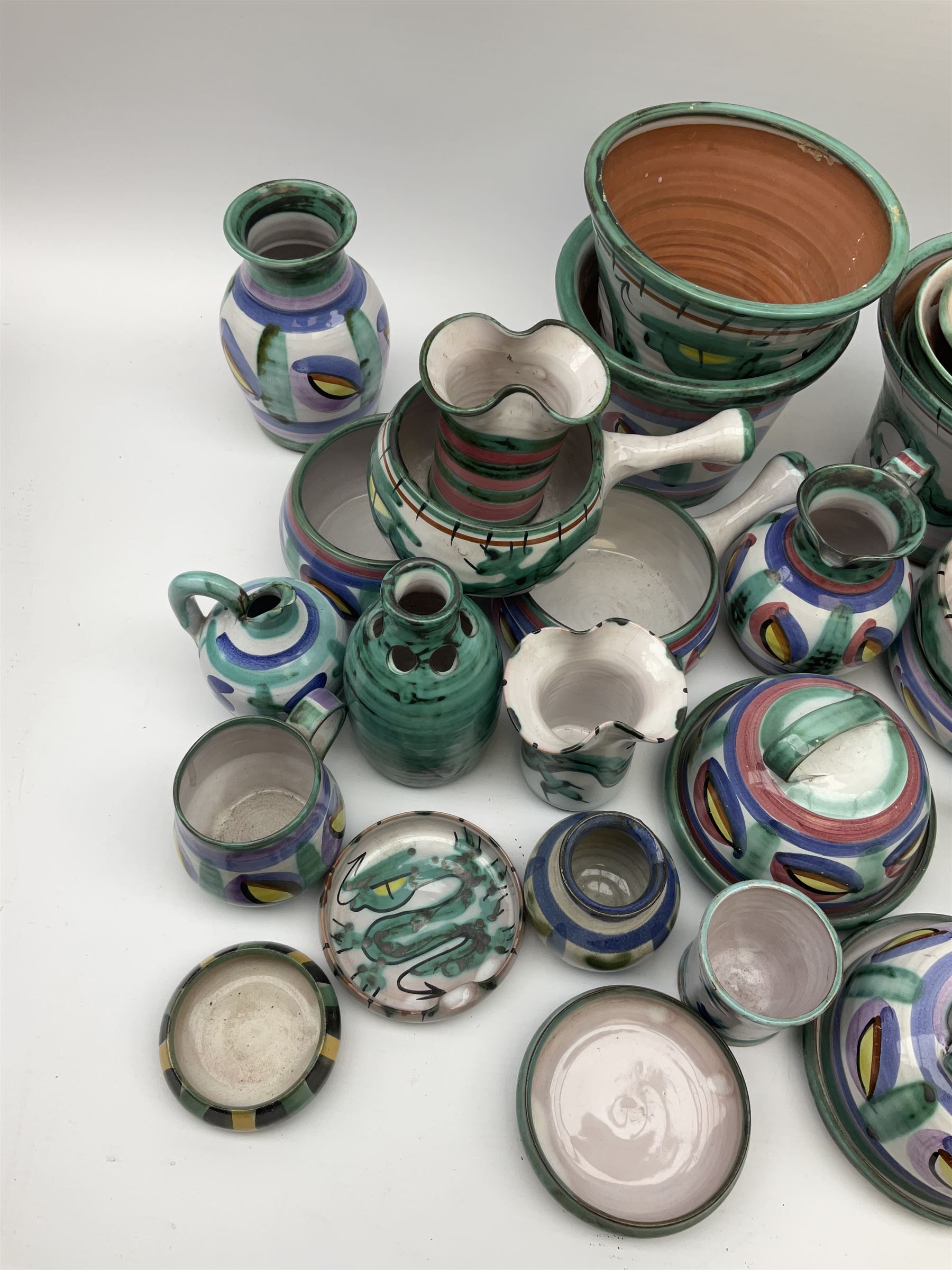 A collection of Tintagel Cornish pottery, to include various planters, jugs, vases, etc., a number of pieces decorated in dragon pattern. 