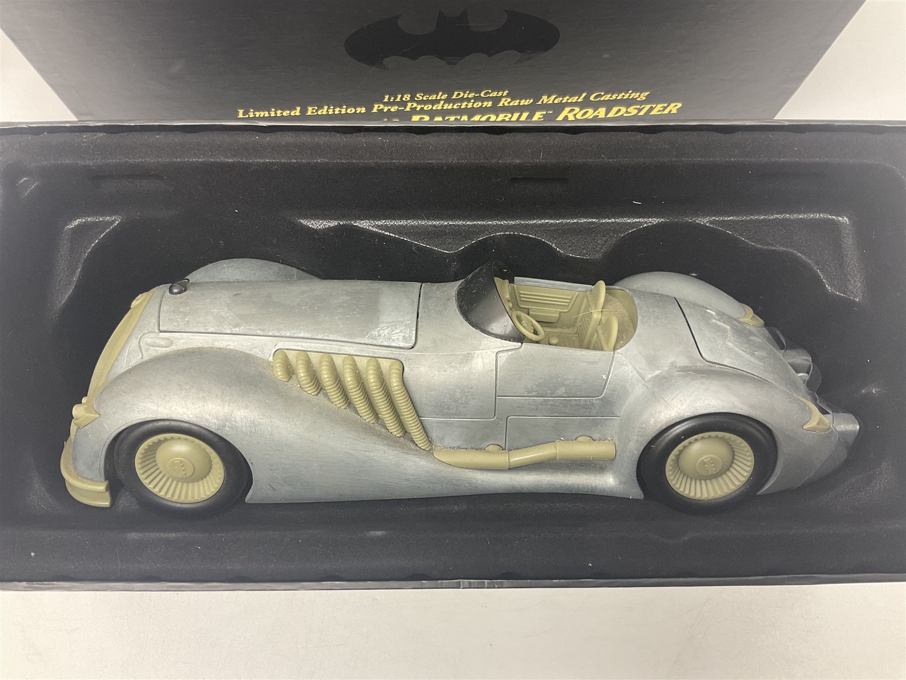 Two Corgi DC Comics die-cast Batmobiles comprising 1:18 scale die-cast Limited Edition Pre-Production Raw Metal Casting 1940 Batmobile Roadster no. 184/300, and 1:24 scale die-cast Limited Edition Raw Metal Casting 1960 Batmobile no. 858/1000, both with original boxes and certificates of authenticity 