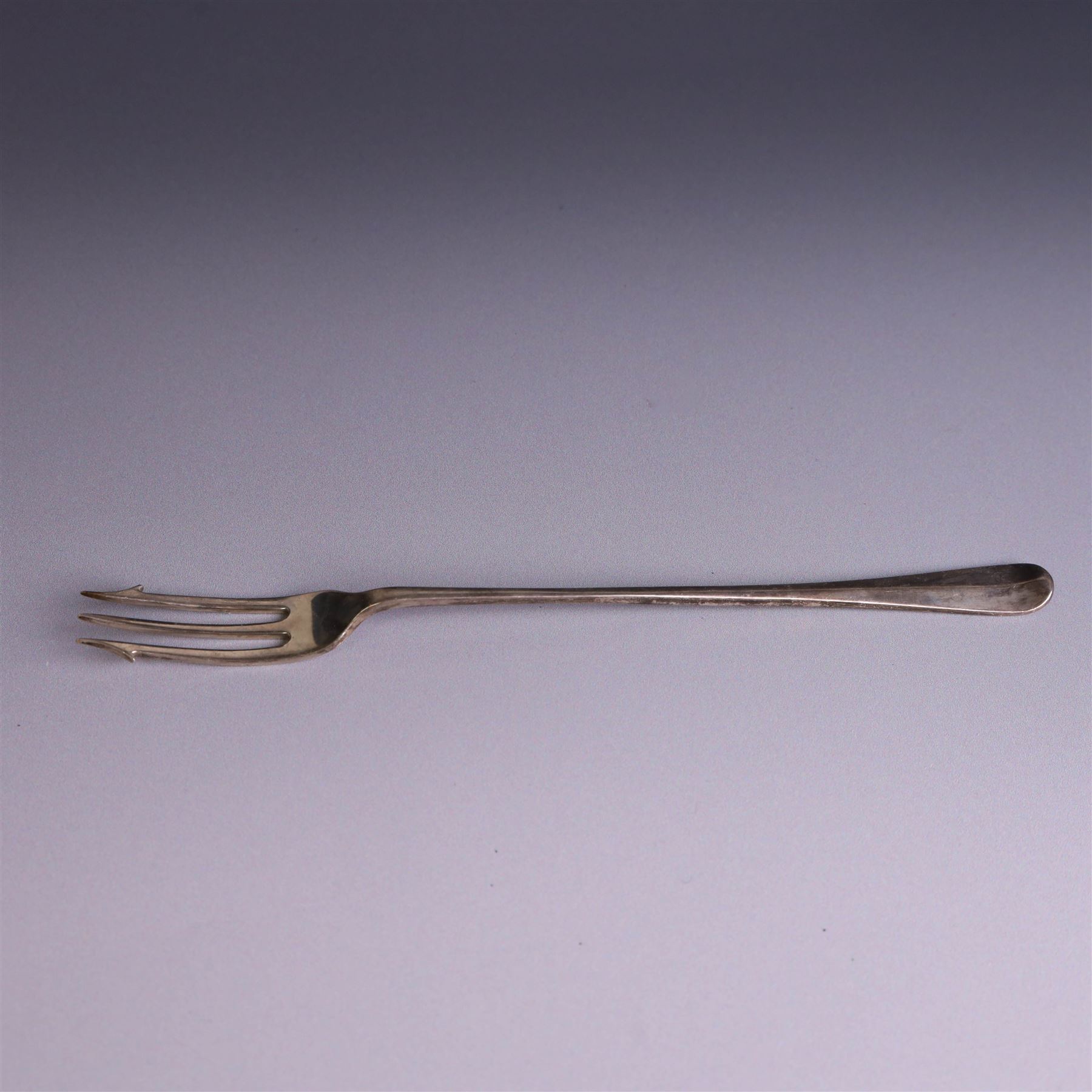 Victorian silver sauceboat, of typical form with embossed floral and foliate decoration, hallmarked London 1886, together with a miniature silver trophy and silver pickle fork, both hallmarked, trophy H7.5cm