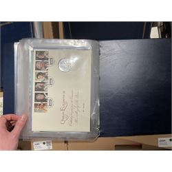 Approximately one hundred and fifteen Royal Mint coin covers, in two ring binder folders and loose, together with approximately 53 grams of Great British pre-1920 and approximately 68 grams of Great British pre-1947 silver threepence coins, and a small quantity of further pre-decimal coins