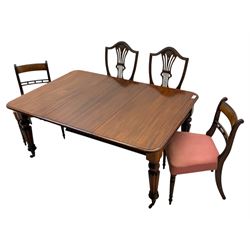 
Late Victorian mahogany extending dining table and four chairs, rectangular top with rounded corners and moulded edge, fitted with two additional leaves, raised on turned and reeded legs with brass castors, with a pair of Victorian mahogany hall chair, with curved top rail and plain splat, padded seat in textured salmon pink fabric, raised on turned and tapering front legs and another pair of early 20th century mahogany dining chair, with shield back and carved pierced splat, serpentine seat rail with striped upholstered cushion, raised on moulded square front legs