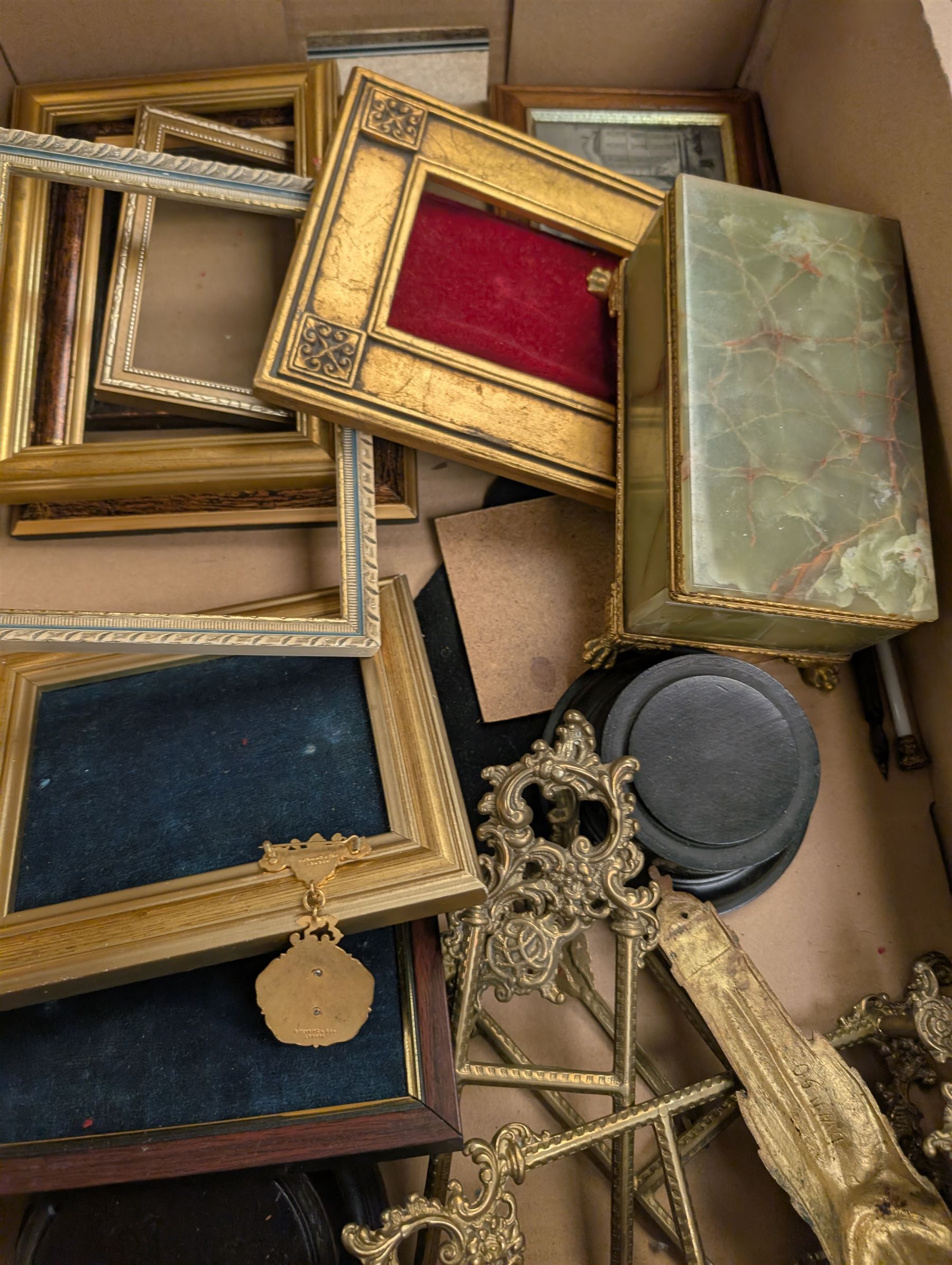 Brass easels, onyx box, frames, costume jewellery, pen nibs, etc, in two boxes