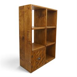 Indigo Furniture - rustic oak shelving unit with cupboard, five open shelves with a cupboard to the lower left, metal cup handles