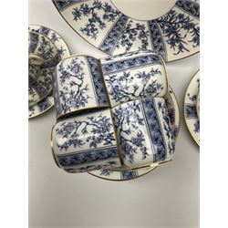 A late 19th century Royal Worcester tea set for six, comprising teacups, saucers, side plates and cake plate, decorated with foliate panels in blue upon a white ground, with printed marks beneath, a number of pieces also numbered W3232. 