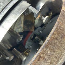 Metal cased drum shaped travelling clock with grey hammered finish, French clockwork movement and stitched leather outer case with shoulder strap; bears manuscript label 'Royal Armament Research and Development Establishment - serial no.09433' D13cm overall