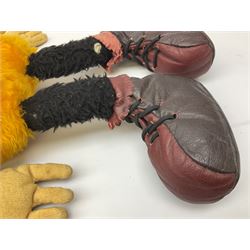 Large soft toy of Mickey Mouse, probably mid-20th century, the black plush body wearing orange shorts, gloves and leather boots, the head with applied painted leather eyes, leather nose and open mouth H68cm
