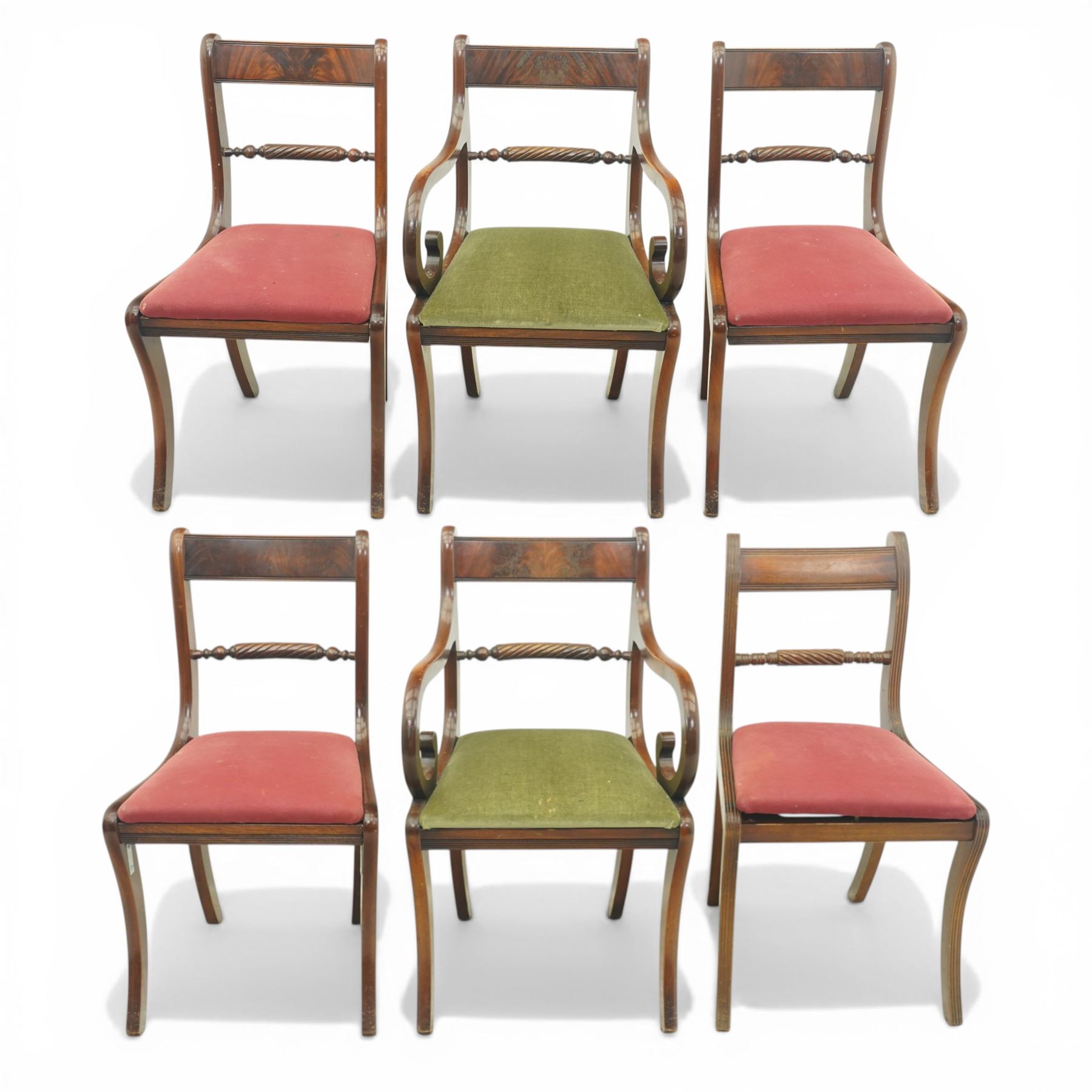 Late 20th century Regency style mahogany dining chairs, set of six comprising four single chairs and two open armchairs, bar backs with figured veneered top rails and turned spindle stretchers, overstuffed seats, on sabre supports