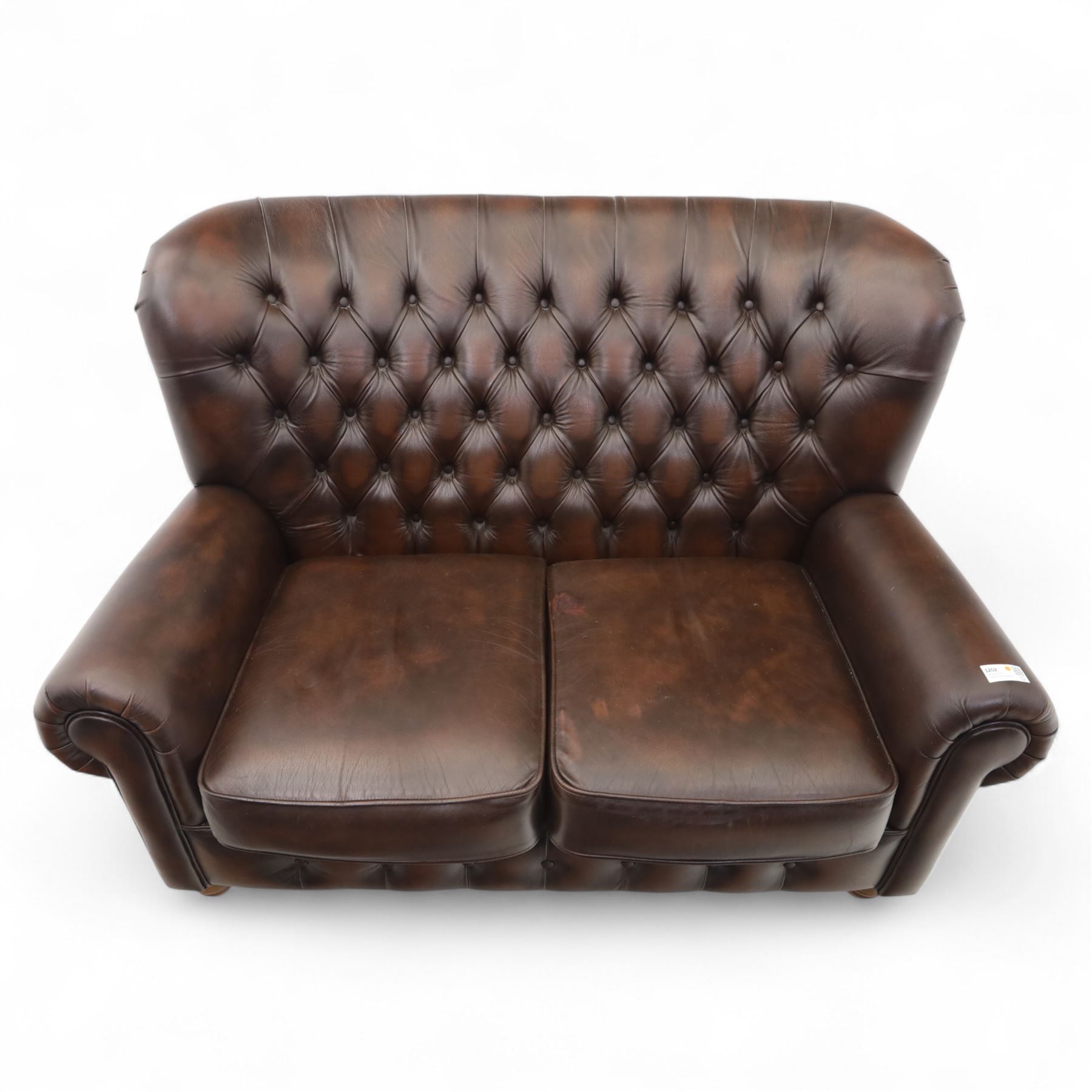 Thomas Lloyd  - two-seater settee, brown leather,  button upholstered back, cushion seats, and wide scrolled arms, raised on bun feet