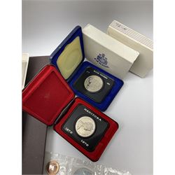 Mostly Canadian coins including 1967 six coin set, various Canadian 50 cent coins, various nickels, Royal Canadian Mint 1990 specimen coin set in blue folder with outer sleeve, various Canadian dollars etc, in folders and loose