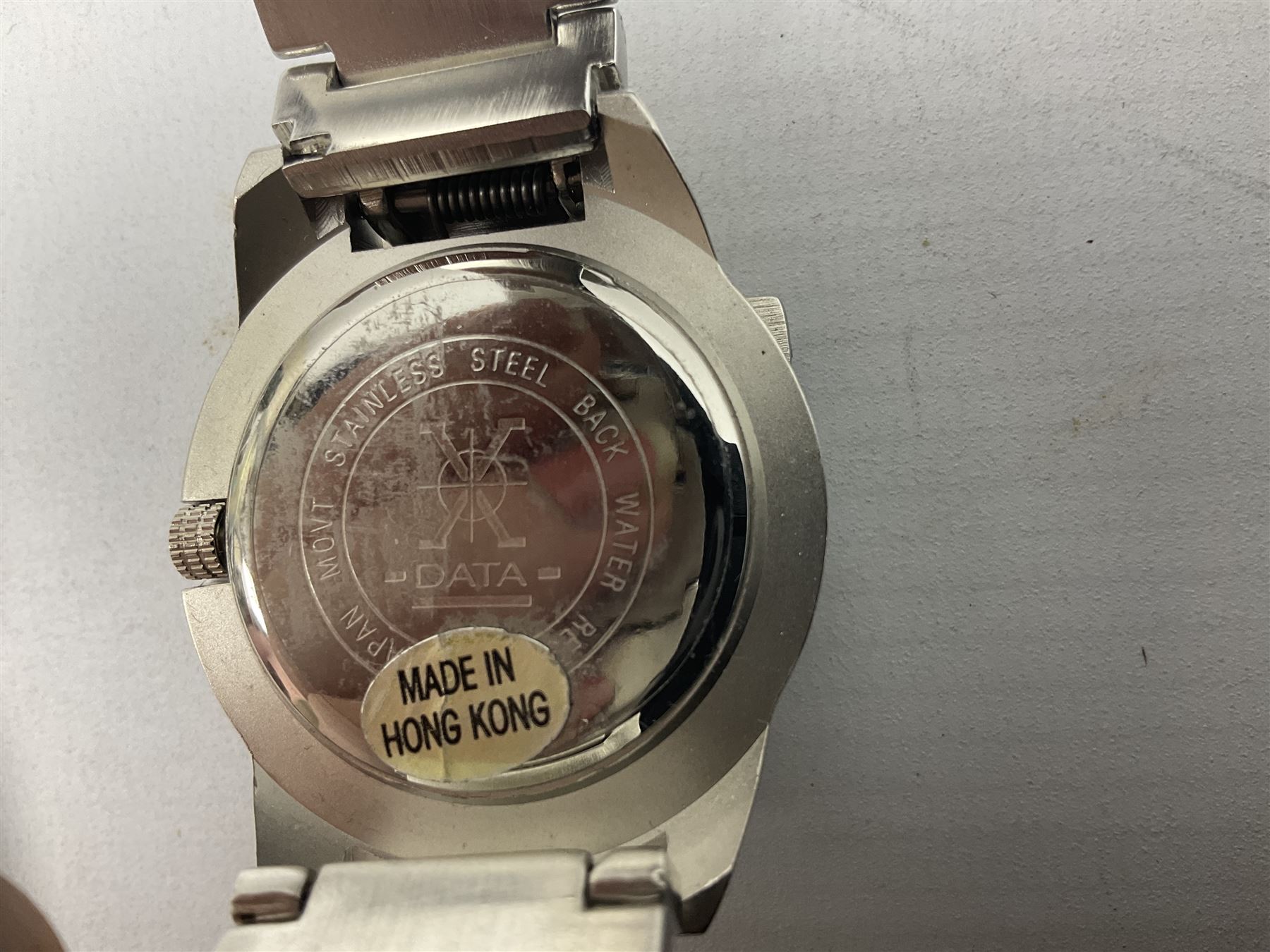 Four X Data stainless steel wristwatches, two Marc Gay wristwatches and one other, all with cover plates