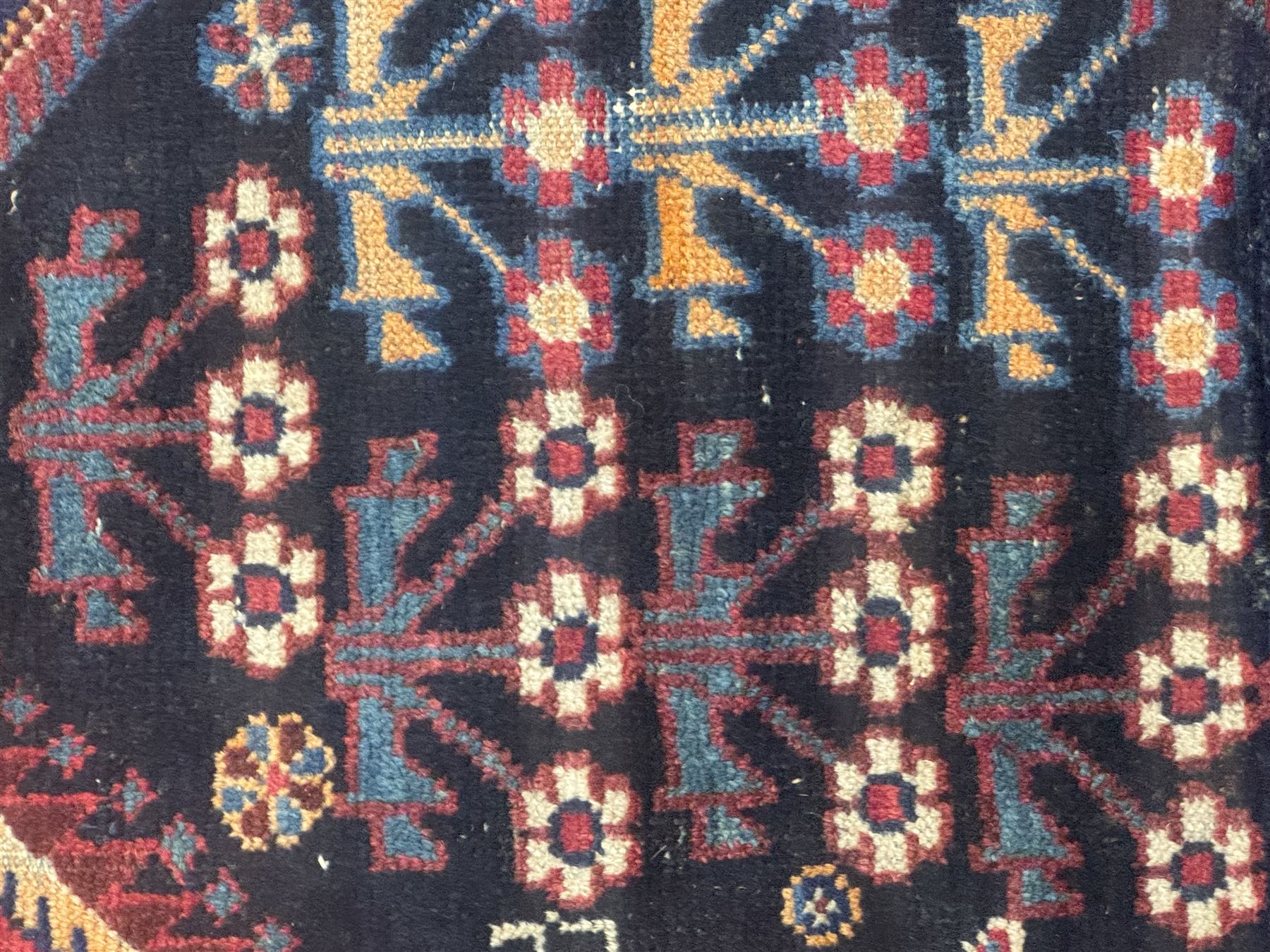 Persian Heriz wool rug, red and ivory field with floral medallion, geometric spandrels, and floral border (157cm x 107cm); Kurdish Shairwan wool rug, red and navy field with three medallions, geometric crosses and serrated border (200cm x 155cm); Persian Qashqai wool rug, golden-yellow field with boteh motifs and wide floral border (127cm x 82cm)
