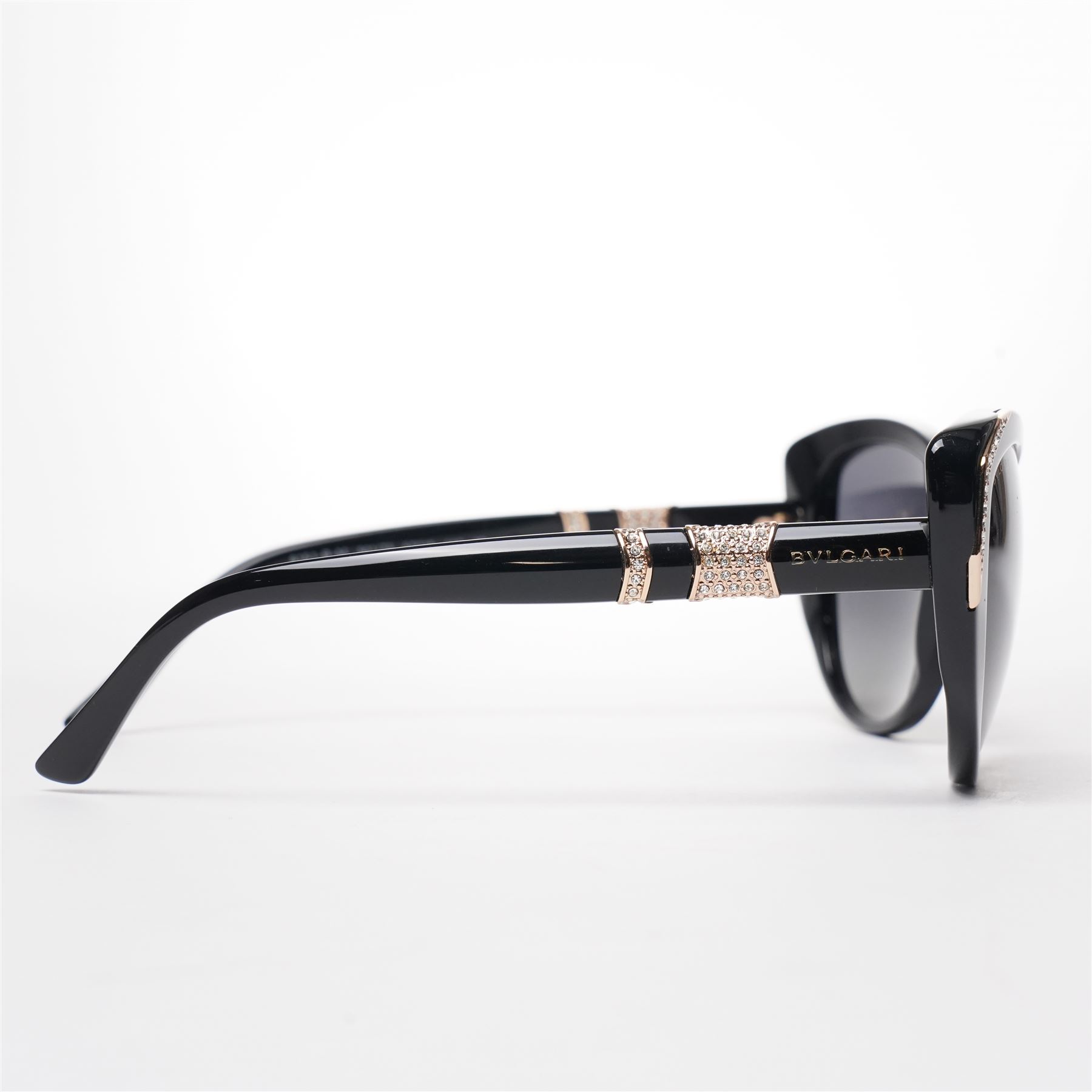 Bulgari - pair of oversized cat-eye sunglasses, with gradient tinted lenses in a black frame, the temples and arms with gold-tone hardware inset with pave-jewelled hinge detail, with original cloth pouch, hard leather case and box