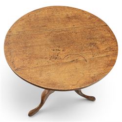 Georgian oak tripod table, plank top raised on a turned baluster column, raised on cabriole supports 