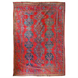 Early 20th century Persian Heriz rug, hand-woven, on crimson ground with angular medallion...