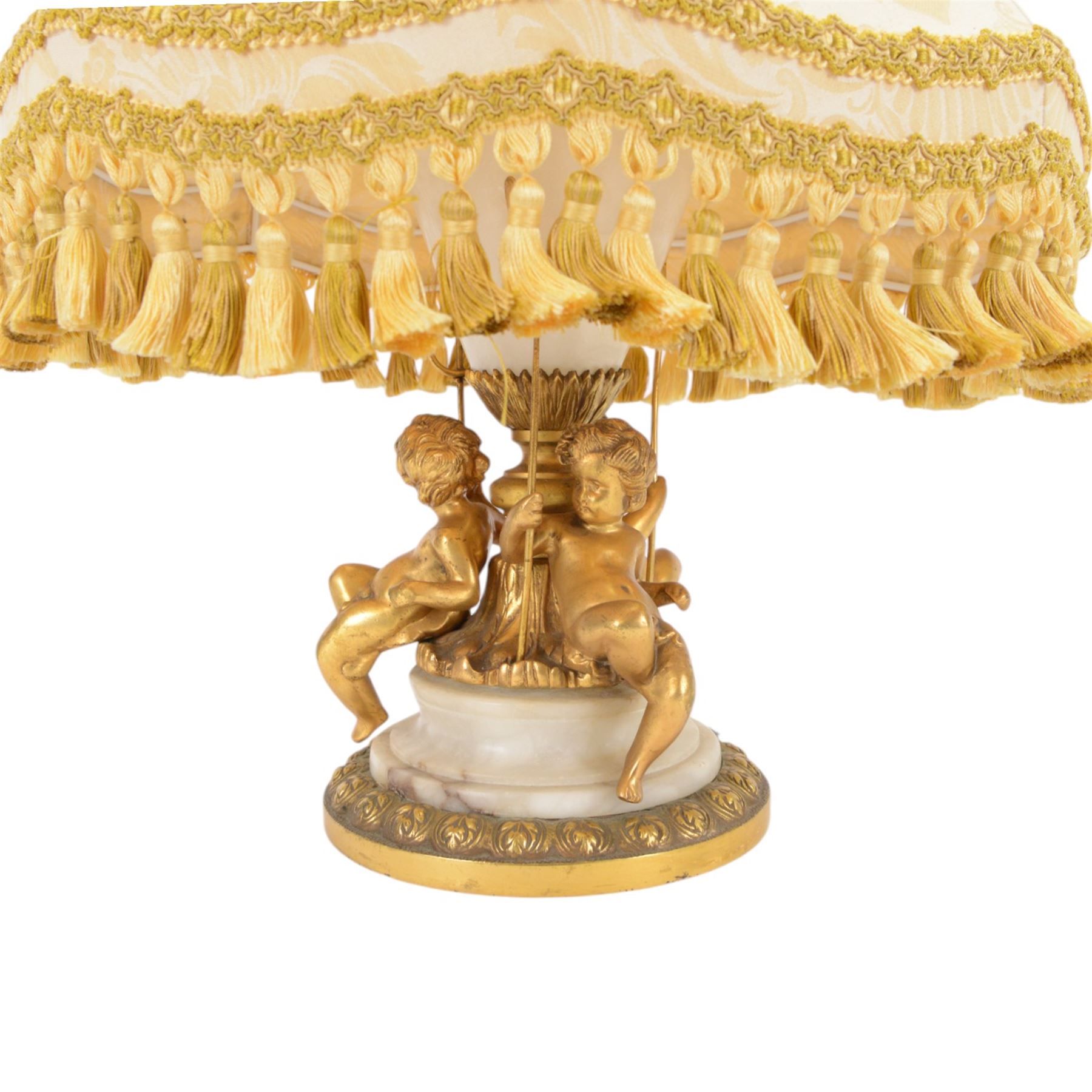 Onyx table lamp, of urn form with scrolling gilt handles, the stepped circular base adorned with three seated putti, H60cm