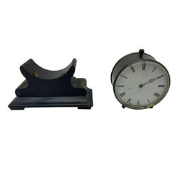 Late 19th century French Drum clock with an 8-day “tick-tack” movement, circular brass case and ebonised wooden stand, white card dial with roman numerals and steel moon hands, Parisian movement stamped VAP (Victor Athanase Pierret) with a deadbeat escapement, integral pendulum and key, wound and set from the rear.