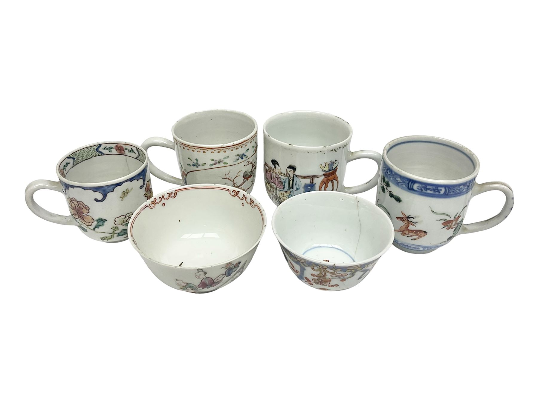 Two 18th century Chinese Yongzheng coffee cups, the first example decorated in polychrome enamel with rooster amidst blossoming peonies, the second decorated with deer and crane among rockwork and pine tree, together with two further 18th century Chinese coffee cups, an 18th century Chinese tea bowl, and a further tea bowl