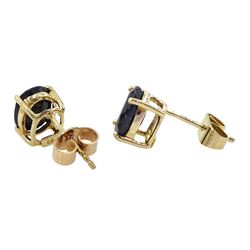 Pair of 9ct gold oval cut sapphire stud earrings, stamped