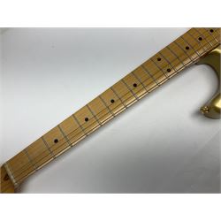 Fender Stratocaster 50th Anniversary 2004 metallic gold electric guitar; serial no.MZ4116369; L98cm; in Spider fitted case with owners manual and other paperwork, strap and belt buckle etc