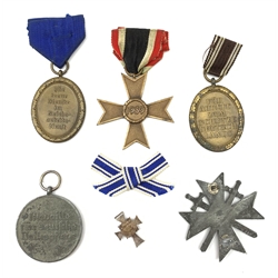 Six WW2 German medals/decorations comprising Red Cross Social Welfare Medal, bronze RAD Long Service award, German Defences Medal, War Merit Cross Second Class, War Merit Cross (Knight's Cross with Swords) and miniature Mother's Cross (6)