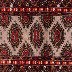Tekke Bokhara hand knotted  runner, crimson field decorated with a series of repeating Tekke gul motifs arranged in rows within narrow geometric borders with chevron and diamond devices, 78x248cm 