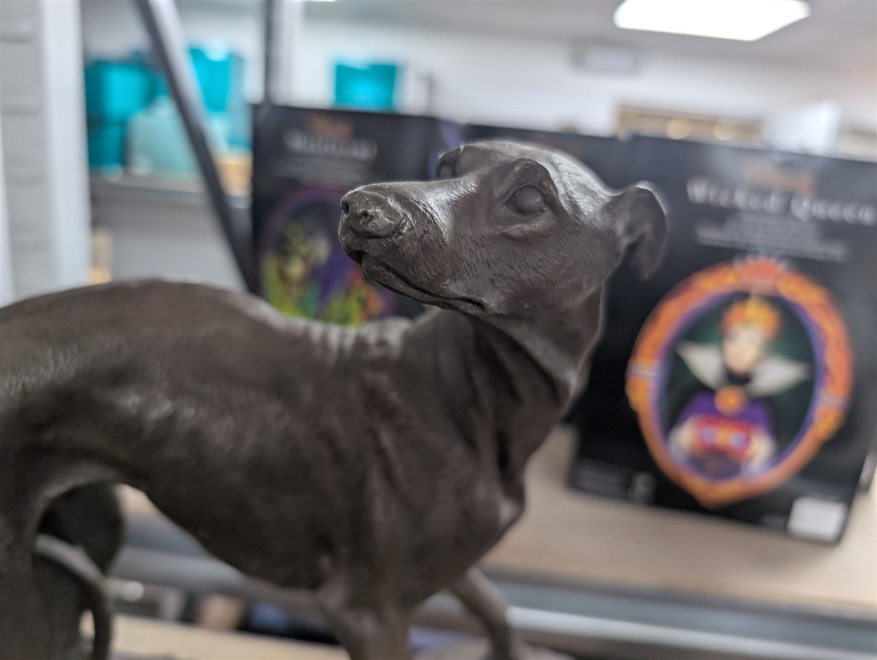 Two spelter dog figures, each upon hardstone bases, tallest H33cm