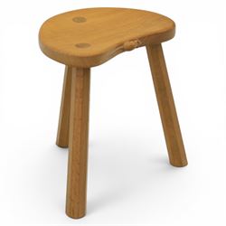 Mouseman - oak three legged calf stool, with carved mouse signature, by the workshop of Robert Thompson of Kilburn