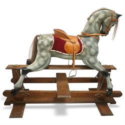 Mid 20th century rocking horse, painted dapple grey with natural mane and tail, leather sa...