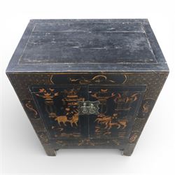 19th century Chinese black lacquer marriage cabinet, rectangular form, twin cupboard doors painted with gilt chinoiserie scenes depicting mounted figures, ritual urns and symbolic objects within patterned borders, central shaped metal lock plate with twin drop handles, lower section decorated with fruiting sprays, standing on stile supports