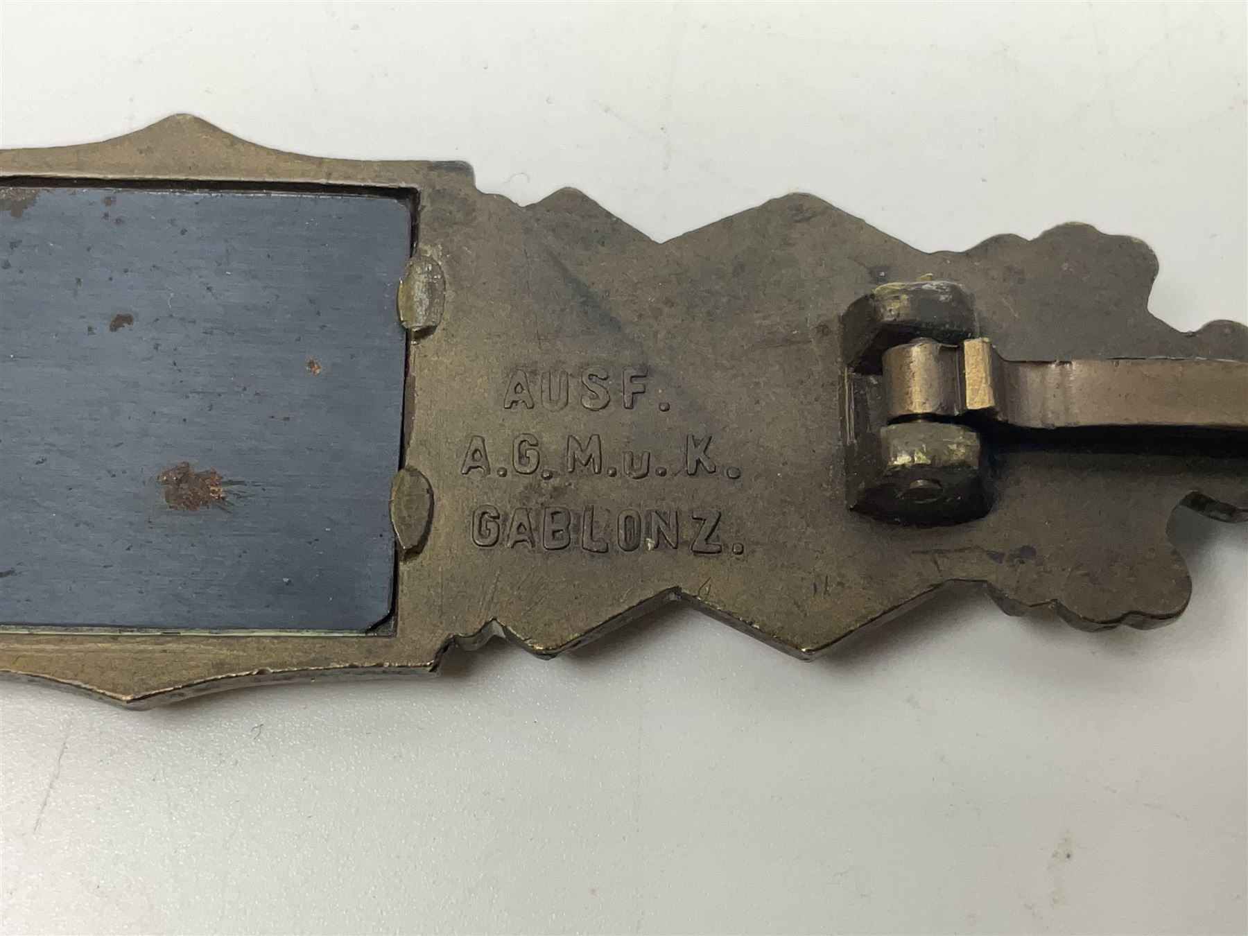 WW2 German Army / Waffen-SS Close Combat Clasp (Nahkampfspange) in bronze with backing plate, original pin and sunken catch; marked verso “FEC.W.E PEEKHAUS BERLIN” and “AUSF. A.G.M. u. K GABLONZ” L9.5cm