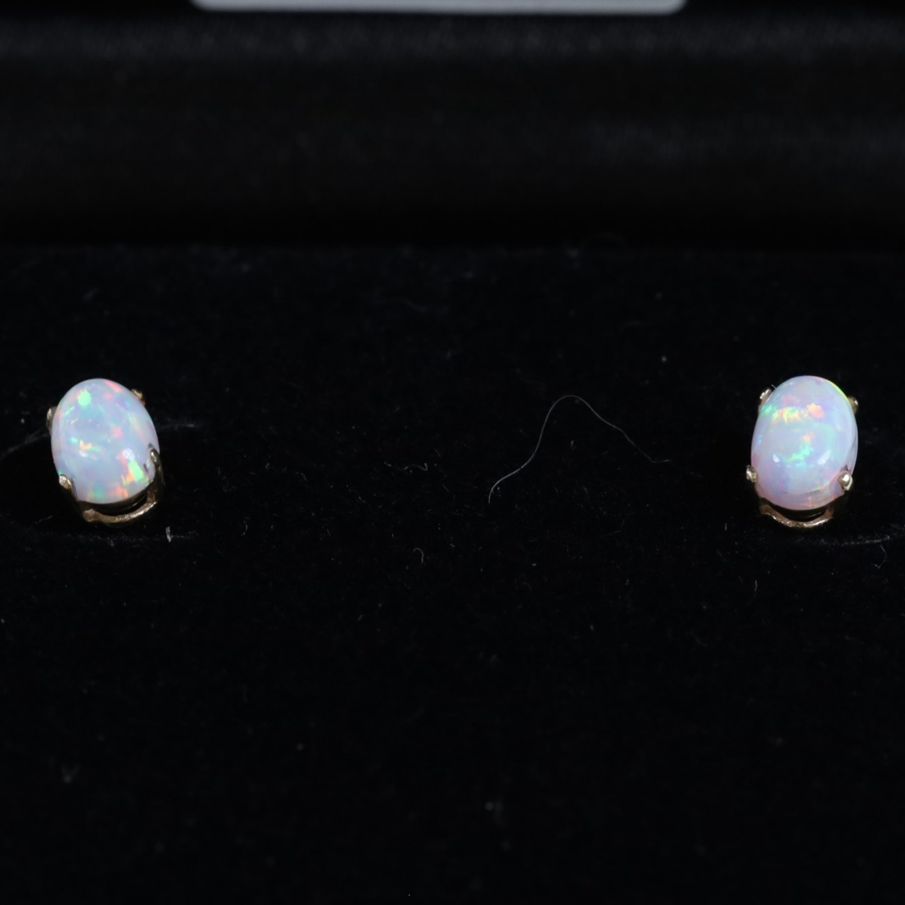 Pair of 9ct gold oval opal stud earrings, boxed
