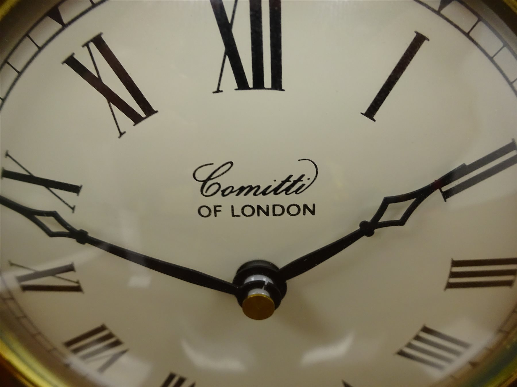 Comitti walnut cased arched top mantel clock, brass bezel and ball feet, No.C009Q, quartz