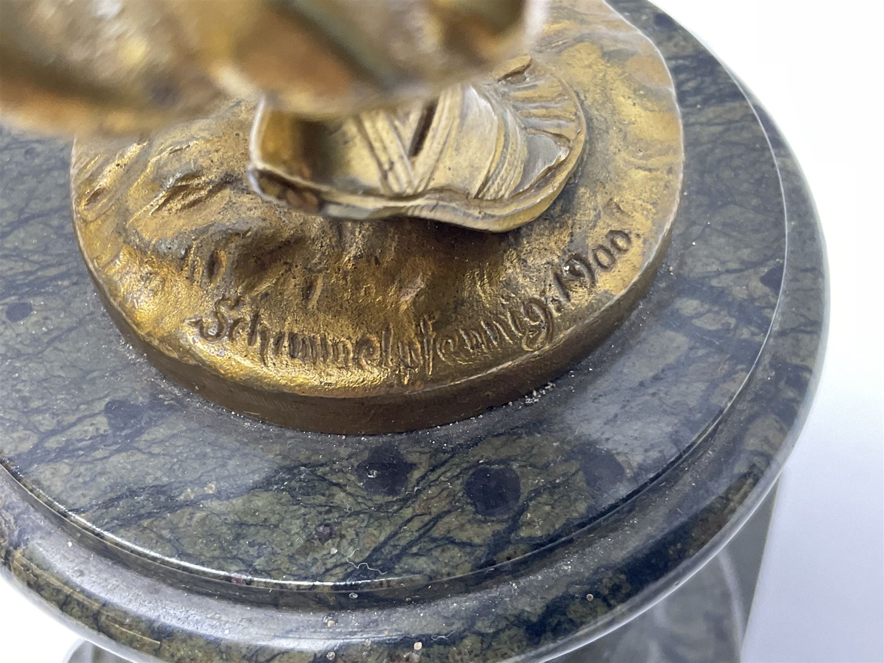 After Oswald Schimmelpfennig (German, 1872-1939): Pair of gilt bronze winged Allegorical female figures, the first example with arm outstretched holding a branch, signed 'Schimmelpfennig 1900', the second with arm raised above her head holding a book and sword in the other, both raised upon marble plinths, H45cm